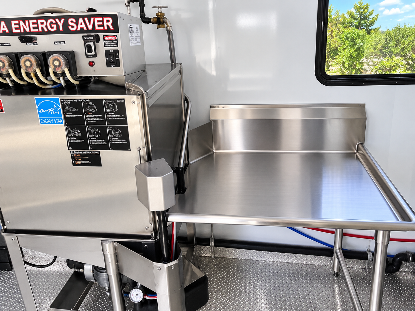 Commercial dishwasher inside a dishwashing trailer
